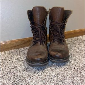 Distressed brown combat boots